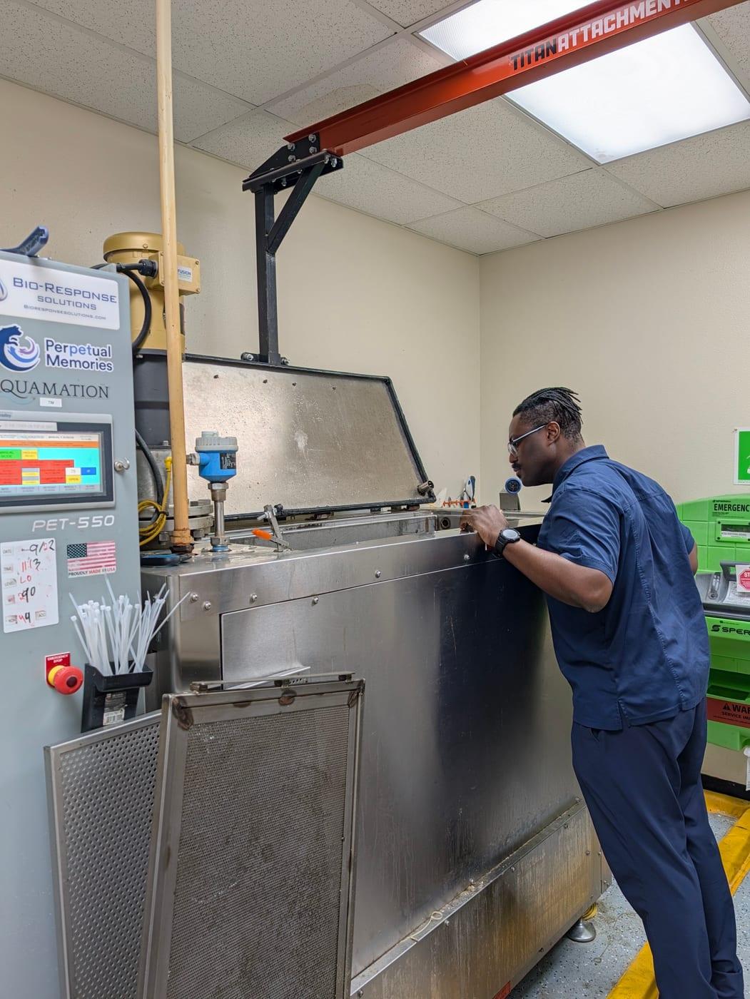 Donato at the aquamation unit in his own facility, working the machine